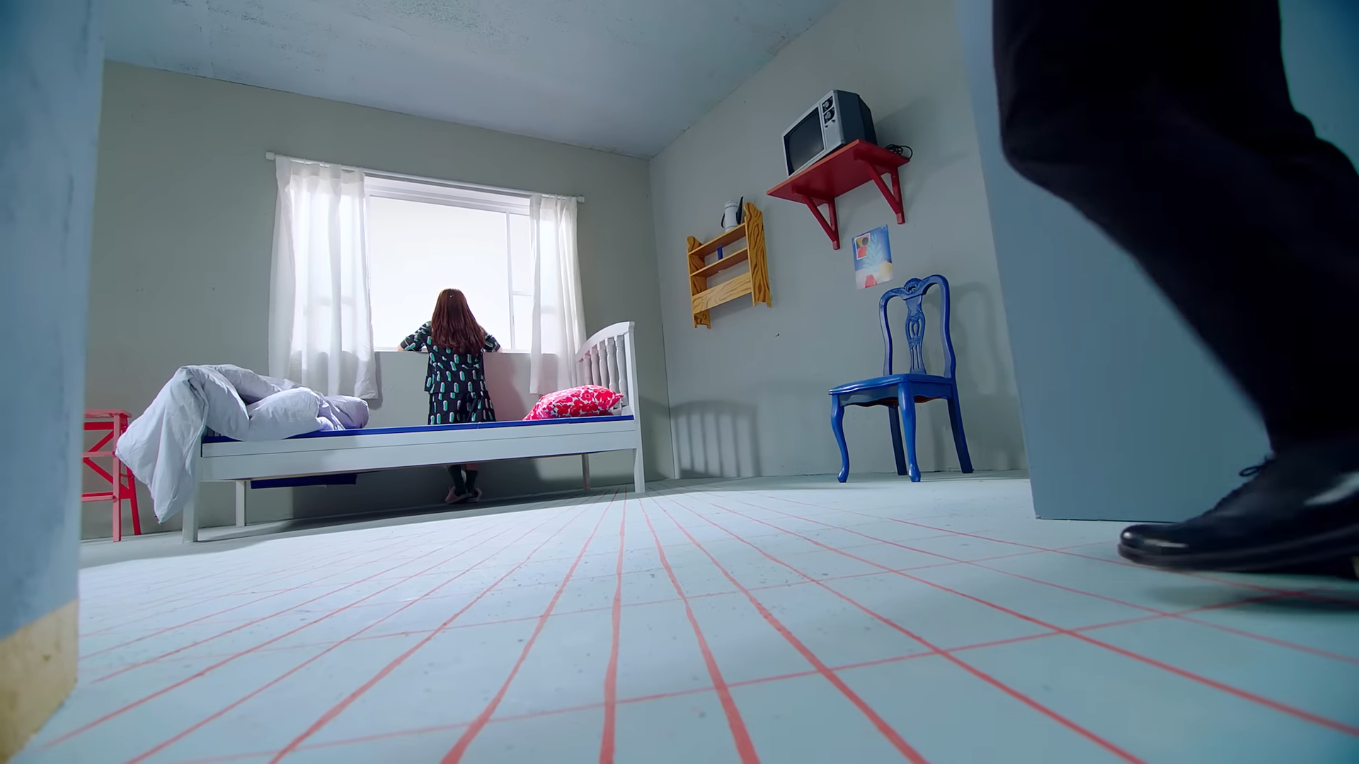 Yeojin looking out the window of the bedroom.